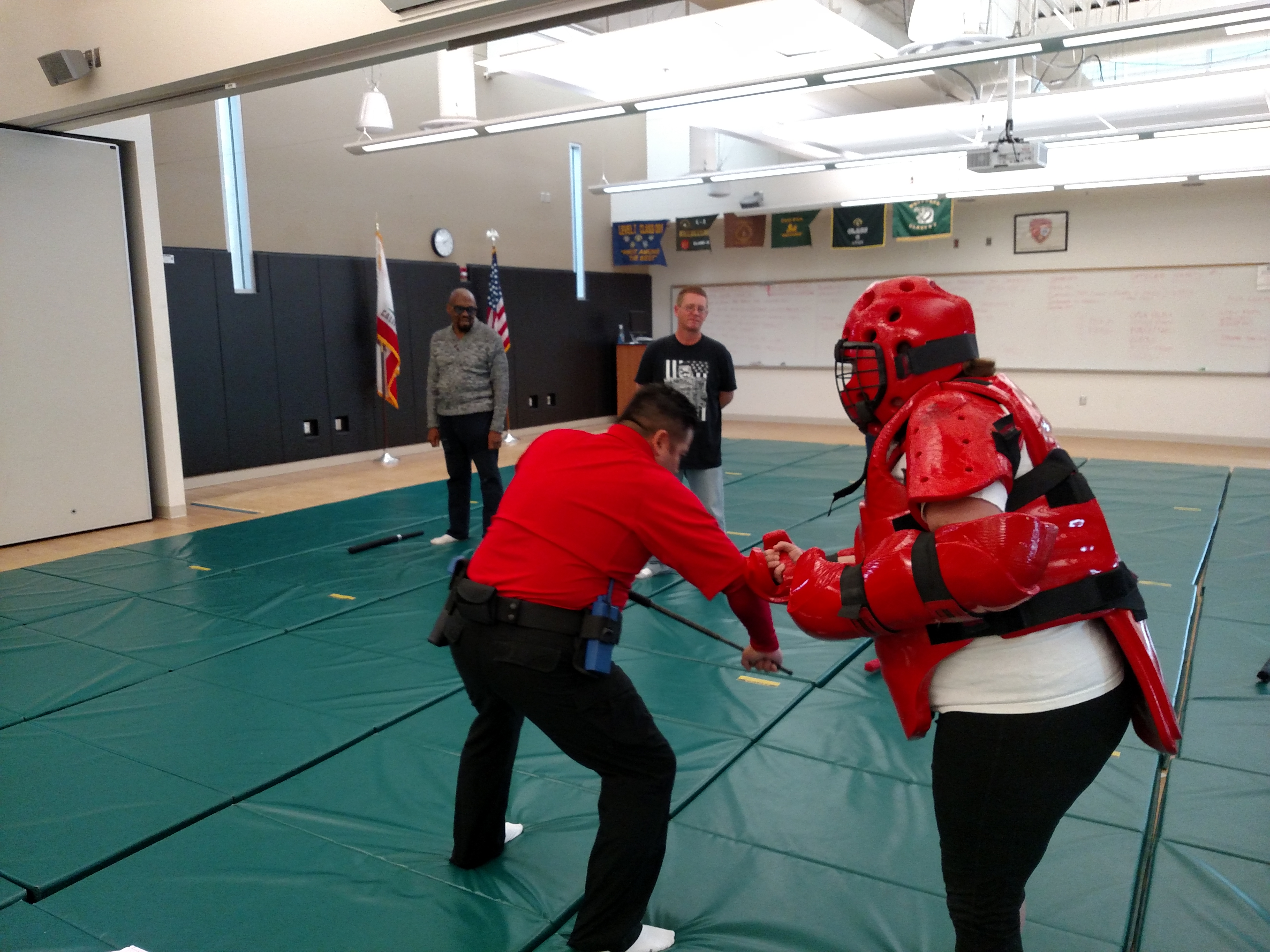 Instructor explaining self-defense method to student