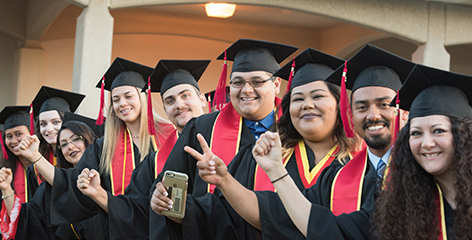 Graduates in line preparing to walk