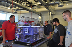 Students and Instructor study HVAC model