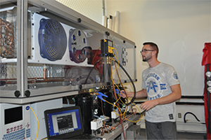 Student working with HVAC equipment