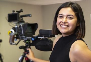 Female student using recording camera