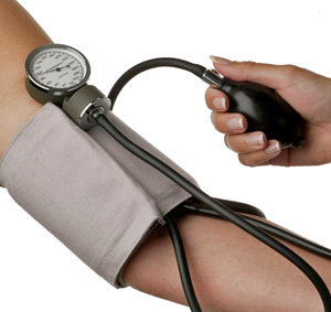 Medical Assistant taking blood pressure