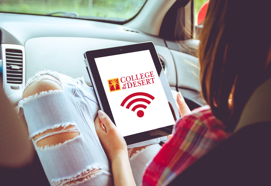 Image of student using Parking lot wifi Decorative Image- Parking lot wifi